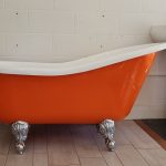 An orange clawfoot tub.