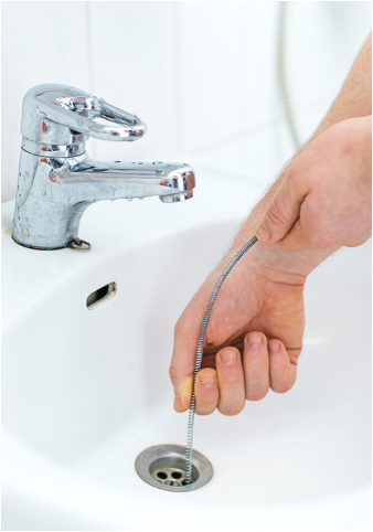 Clogged drain being fixed by a plumber in Glenview, Illinois